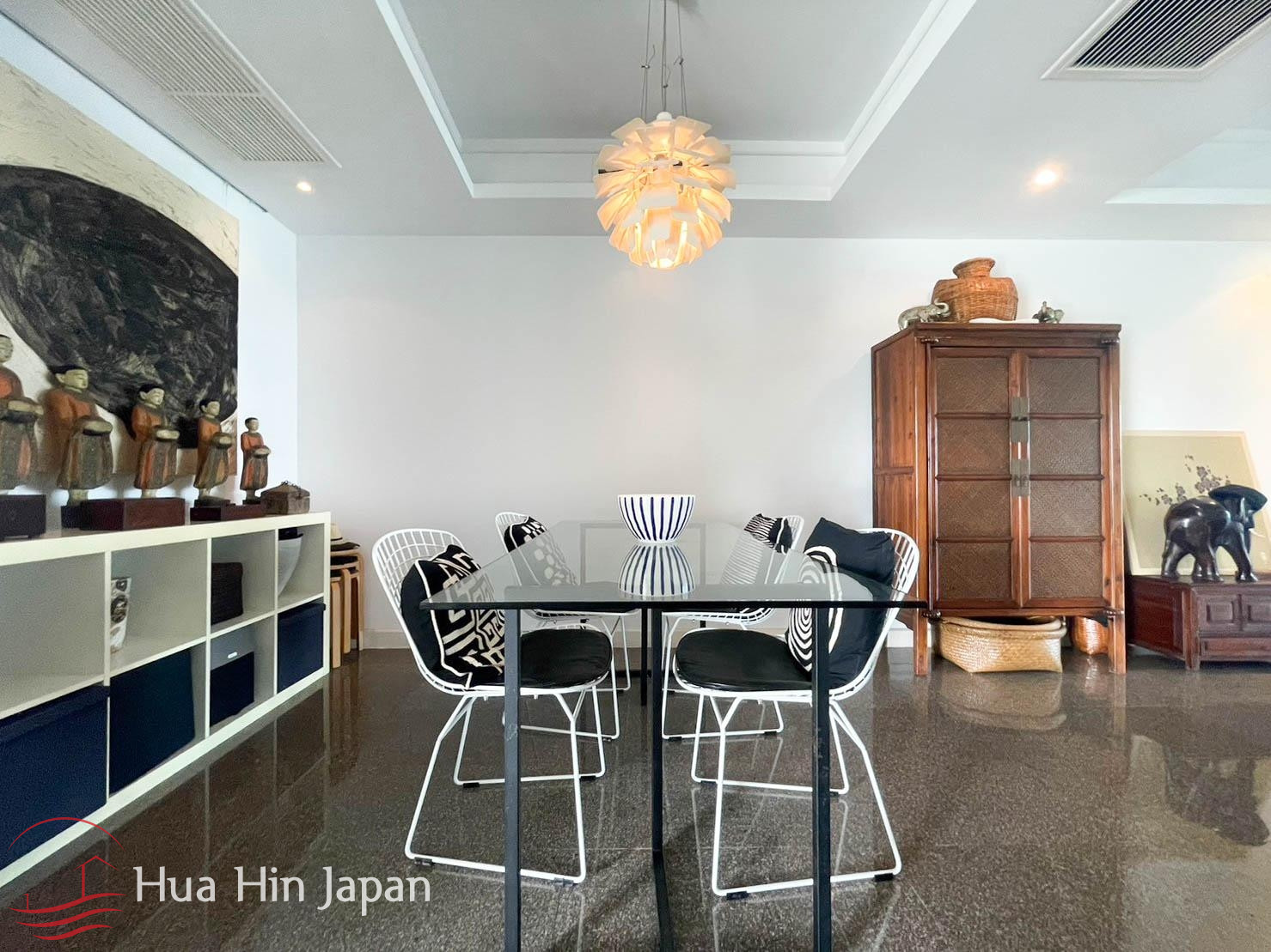 Modern dining room with dining table, chairs, and large windows