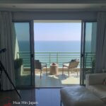 Ocean view from apartment balcony with outdoor seating