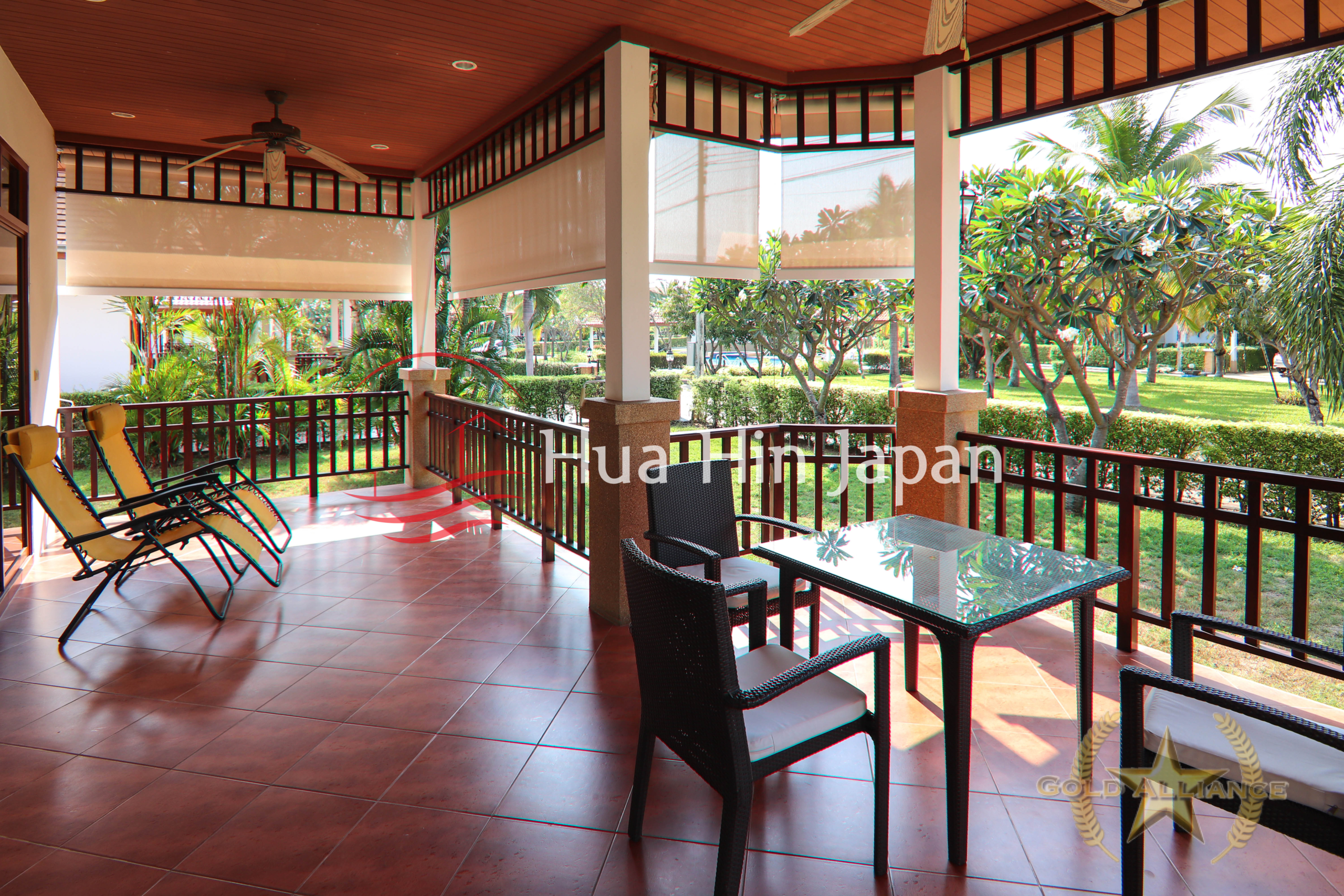 Traditional-style villa balcony with chair abd table