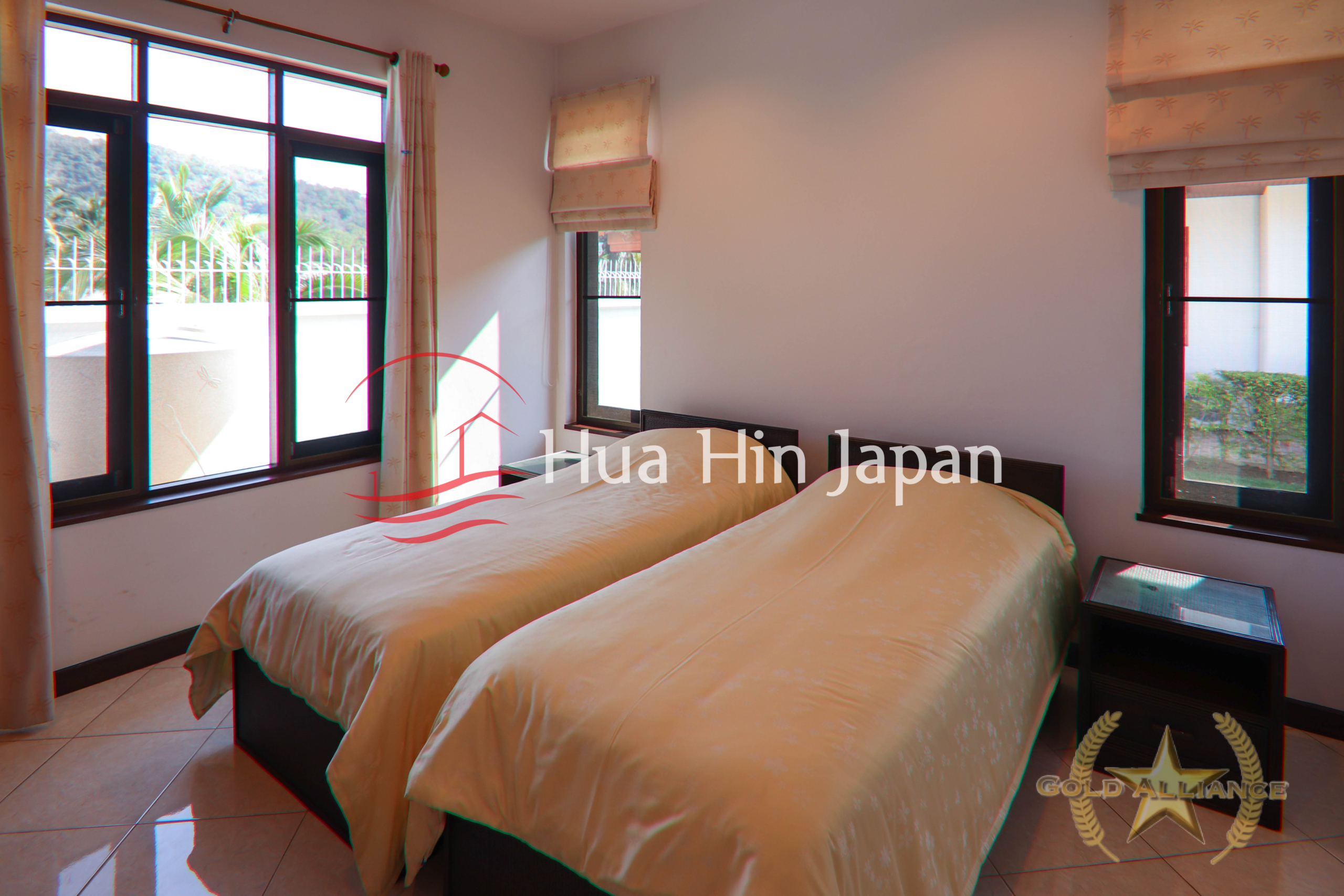 Traditional-style villa bedroom with 2 bed