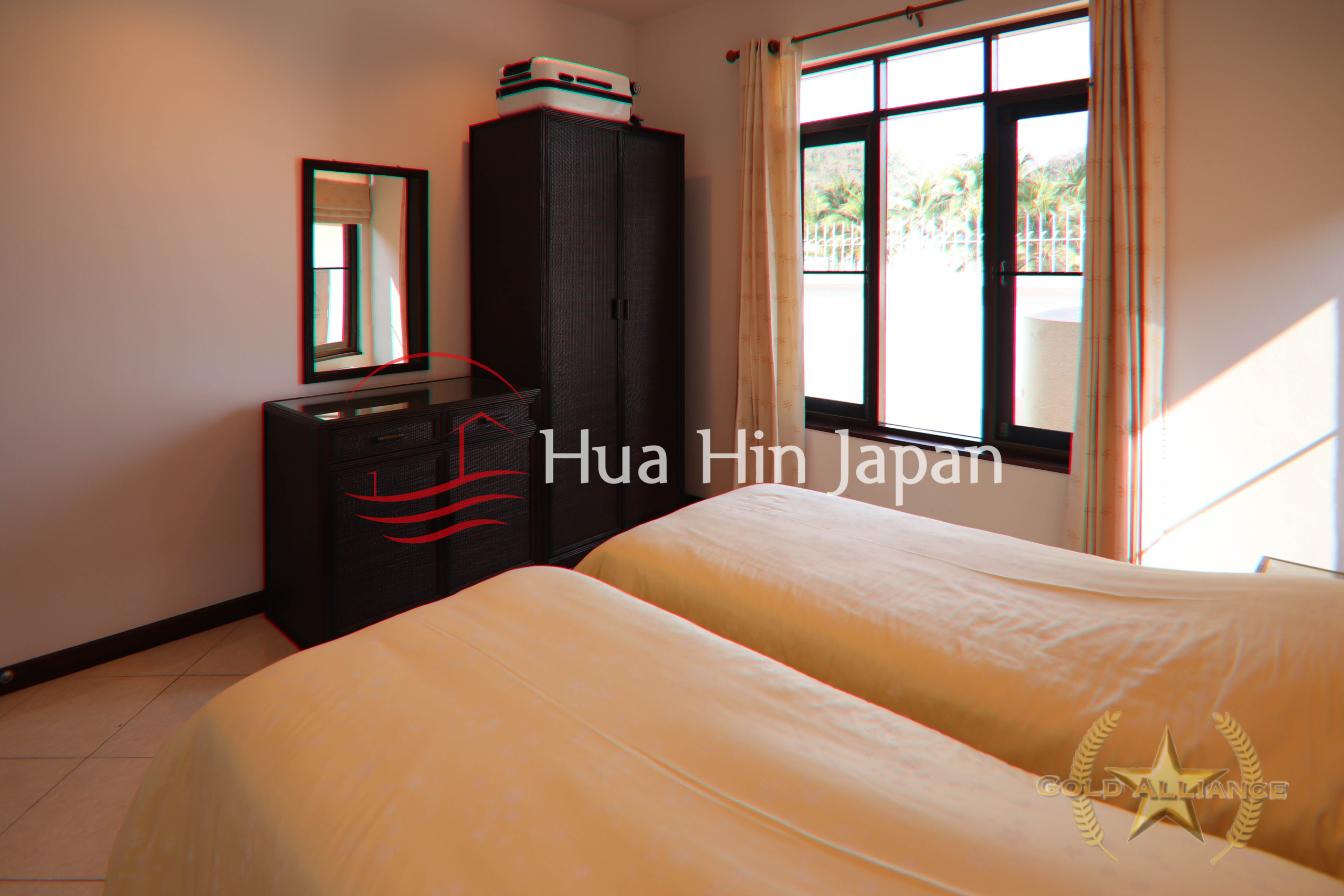 Traditional-style villa bedroom with 2 bed