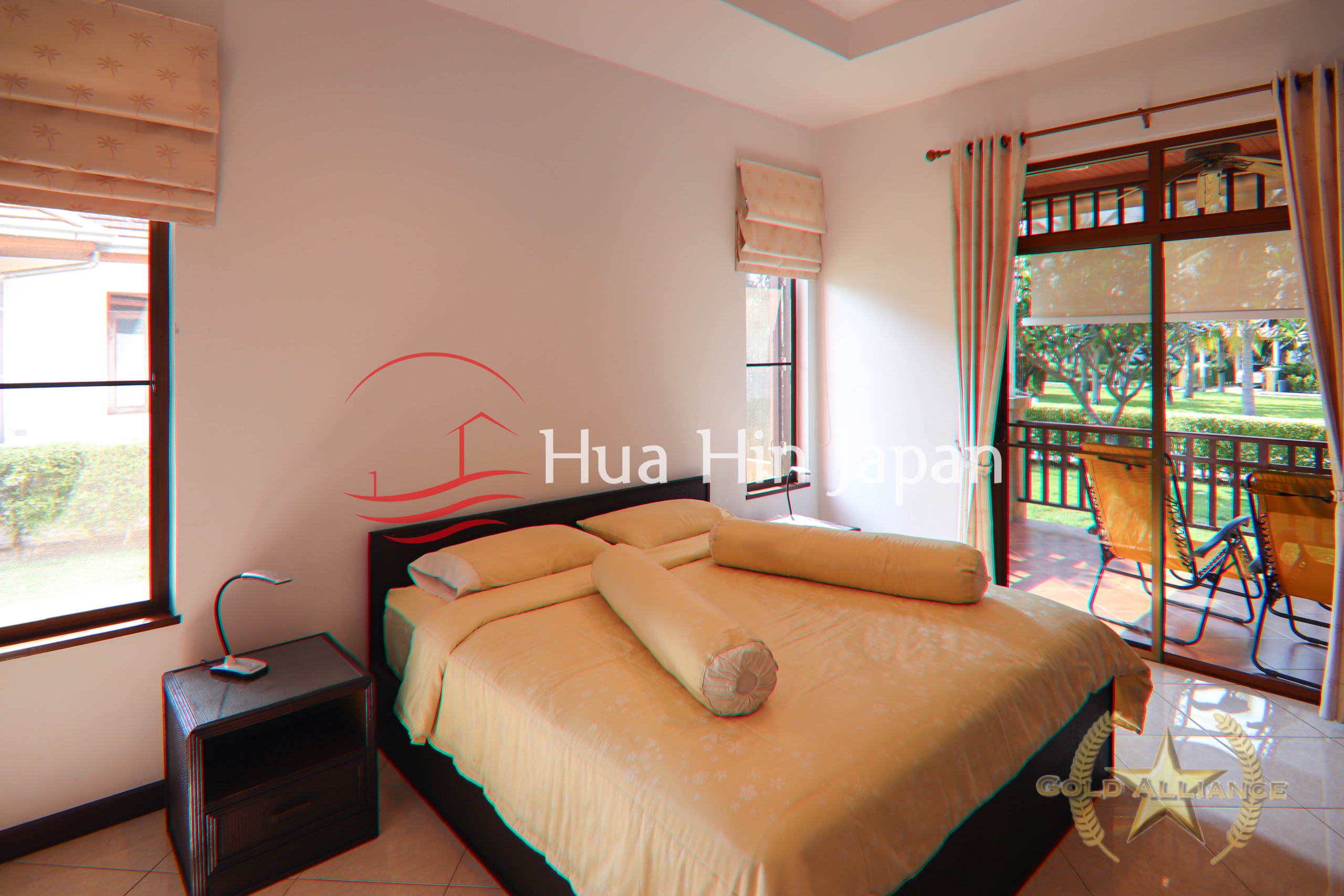 Traditional-style villa bedroom