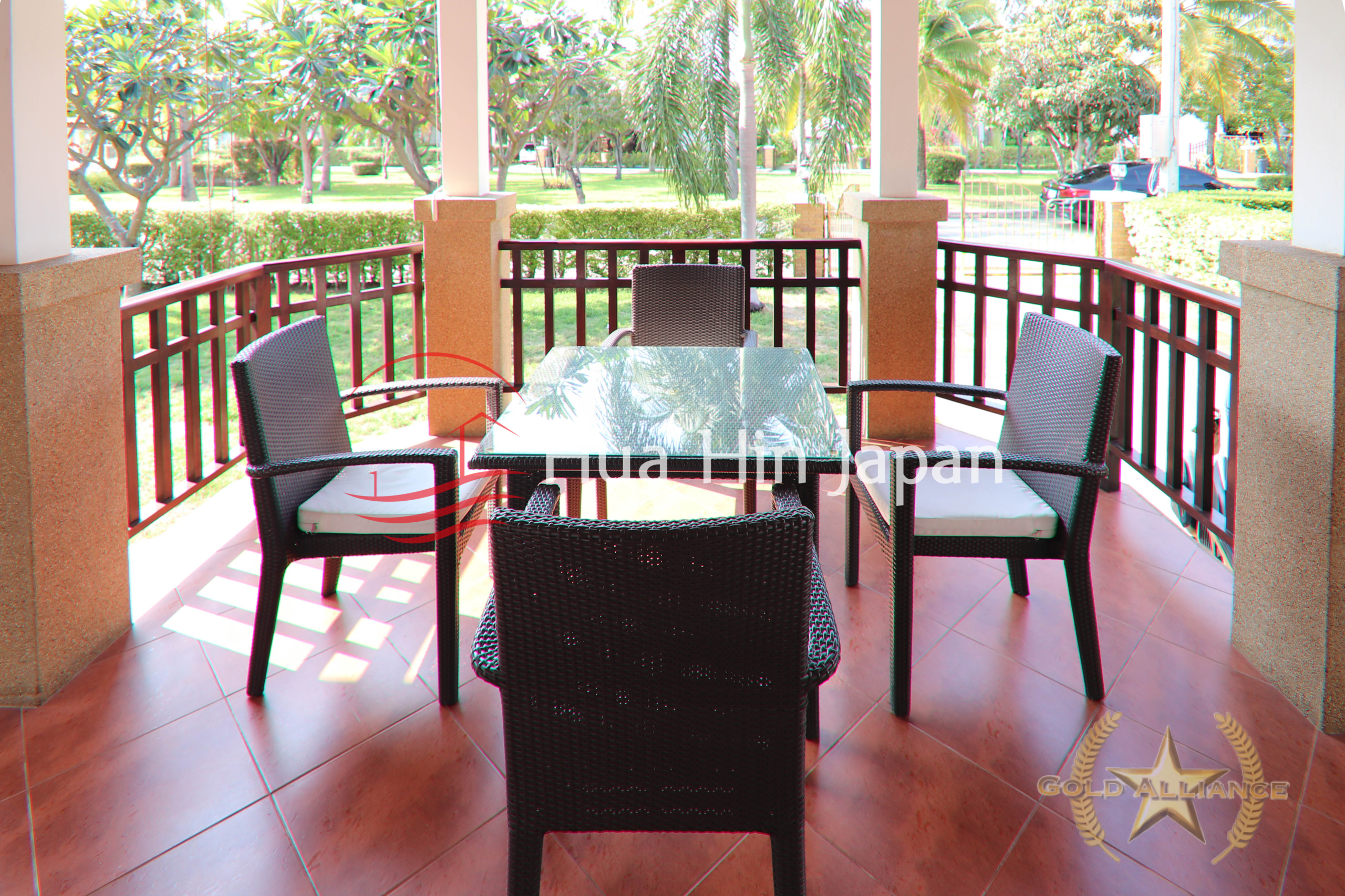 Traditional-style villa balcony with chair abd table