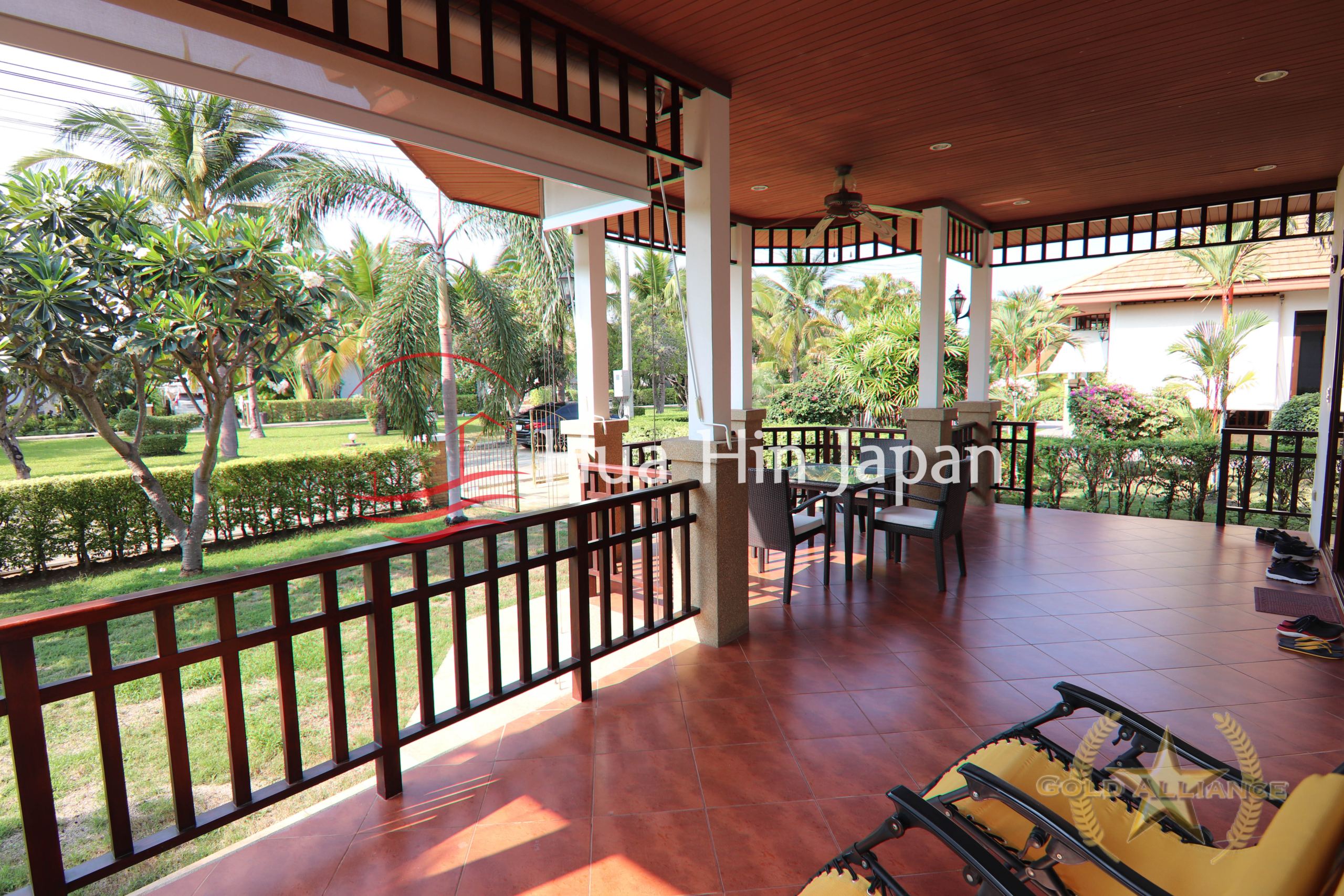 Traditional-style villa balcony with chair abd table