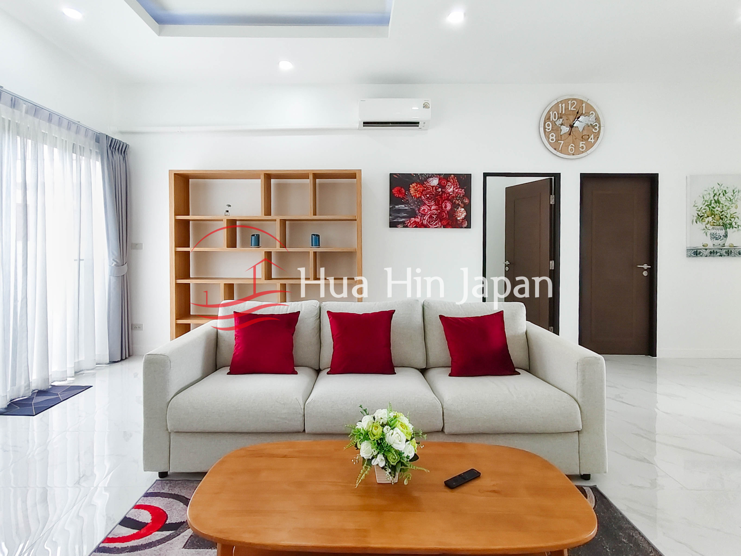 Modern bedroom with wooden shelving, air conditioner, and large window