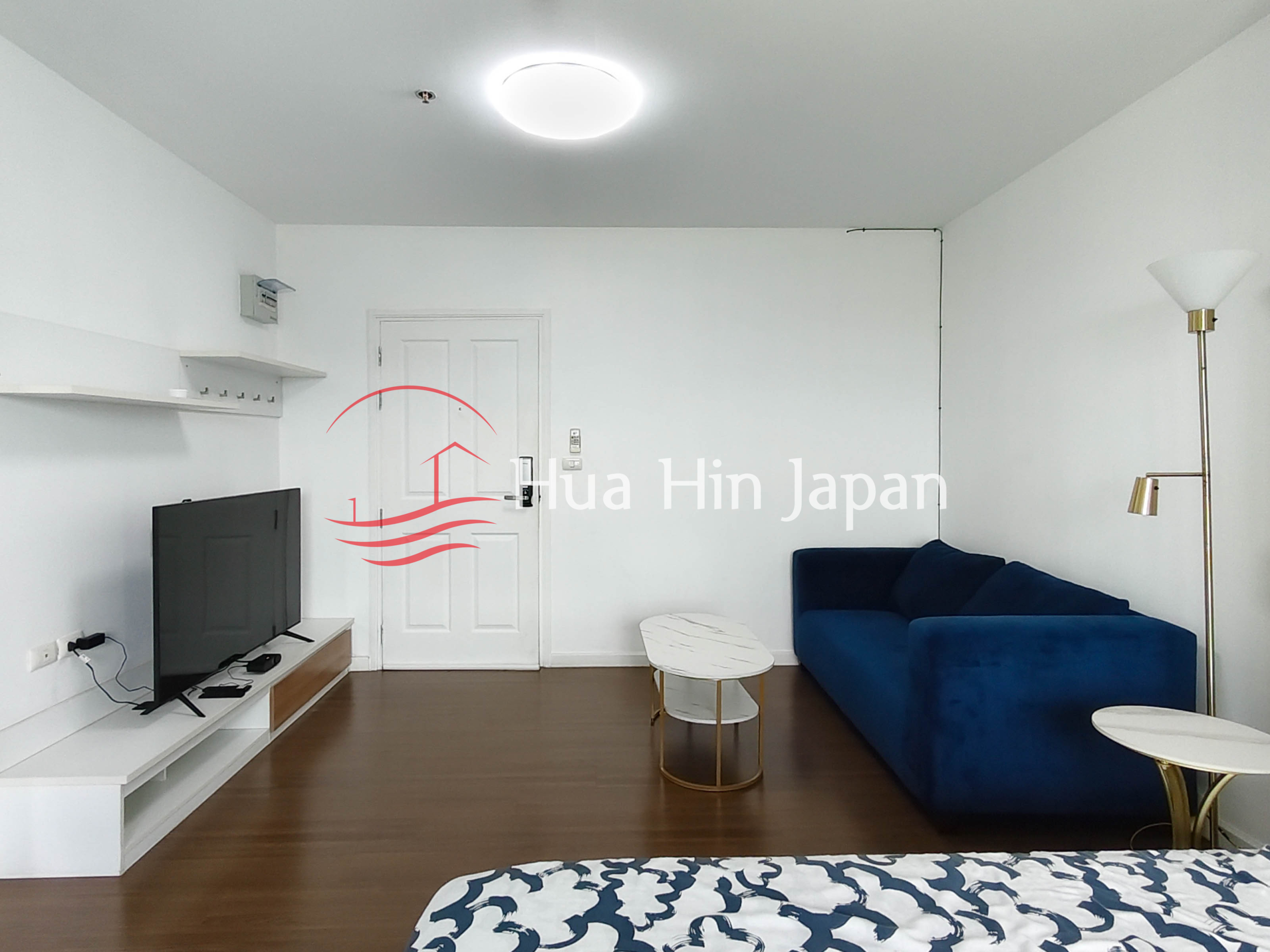Studio room for sale at Baan Kieang Fha condominium drawing area with sofa, tv, and other furniture